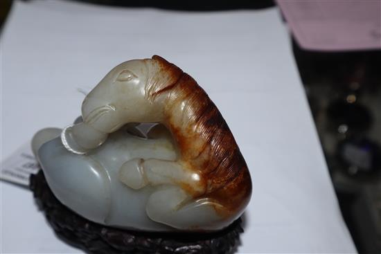 A Chinese pale celadon and russet jade horse, wood stand 9cm high including stand